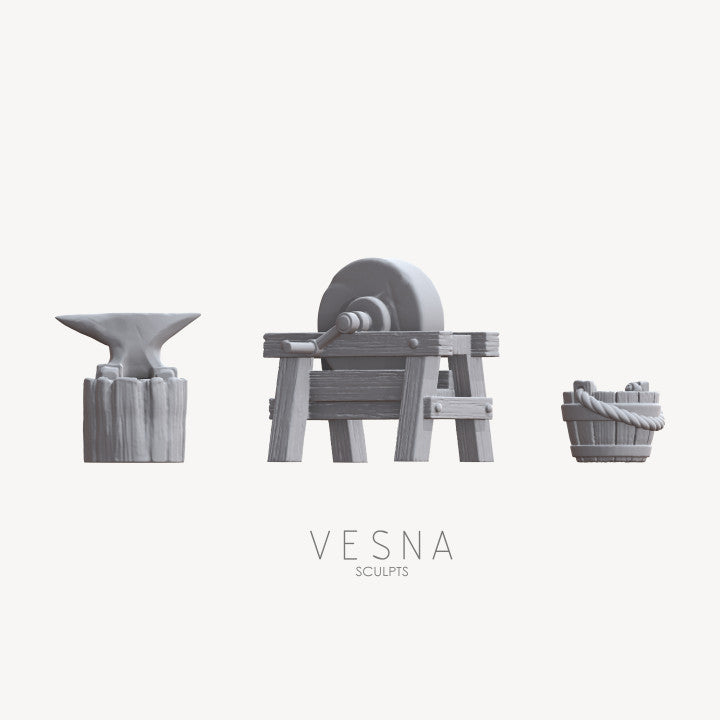 Blacksmith anvil and grindstone